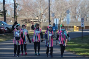 a group of people walking down the street